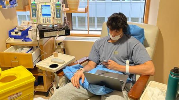 College basketball player Garrett Johnson in a hospital while undergoing chemotherapy